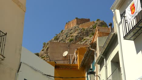 A-View-of-a-Historic-Town-With-a-Castle-Perched-on-a-Nearby-Mountain-in-Borriol,-Spain---Close-Up