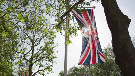 Union-Flag-Hanging-Across-Pall-Mall-Street-In-The-City-of-Westminster,-Central-London