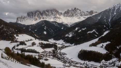Post-card-first-snow-autumn-winter-fresh-snowfall-cinematic-Timelapse-sunset-clouds-Val-di-Funes-village-Dolomites-northern-Italy-St-Santa-Magdalena-Maddalena-Johann-Chapel-Church-Italia-Bozen-Bolzano