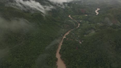 Flying-through-clouds-at-Semuc-champey-the-Cahabon-river-Guatemala,-aerial