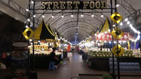 People-shopping-at-Stalls-of-street-food-night-market-in-large-marquee-tent