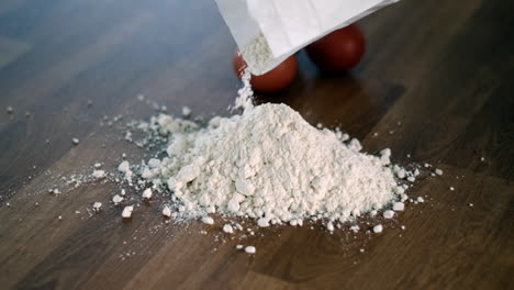Pouring-Flour-on-Wooden-Table-for-Baking-Preparation