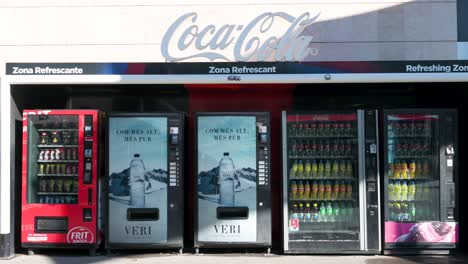 Snacks,-water,-and-soda,-such-as-Coca-Cola-and-Fanta,-are-seen-for-purchase-on-beverage-vending-machines