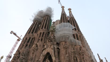 Worm’s-eye-view-of-the-Sagrada-Familia-towers,-the-largest-unfinished-Catholic-church-in-the-world,-and-part-of-a-UNESCO-World-Heritage-Site