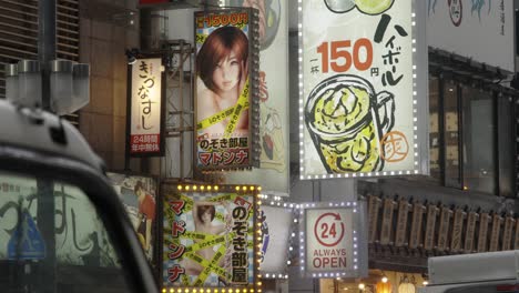 Neon-Street-Signs-for-Restaurant-and-Adult-Entertainment,-Kabukicho,-Tokyo,-Japan