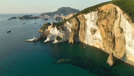 Large-tuff-and-kaolin-rock-formation-with-Ponza-Bay-in-the-background