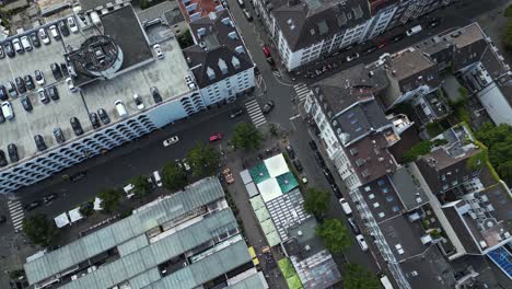 Downtown-Dusseldorf,-aerial-panning-view-of-the-city-streets-and-rooftops