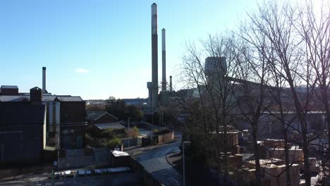 Pilkington-glass-factory-warehouse-buildings-aerial-view-descending-town-street