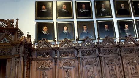 Tilt-up-shot-showing-hall-of-peace-in-Münster-City-with-gallery-and-portraits