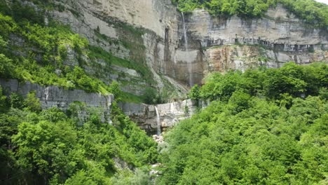 Majestic-Okatse-Falls-Cascading-Down-Limestone-Cliffs-in-Imereti,-Georgia