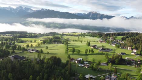 4K-drone-shot-of-beautiful-misty-sunrise-at-Ramsau-am-Dachstein,-Styria,-Austria