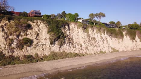 4K-Aerial-Footage-of-Cliffs-in-Malibu,-California-near-Dume-Point-With-Mansions-on-a-Sunny-Day