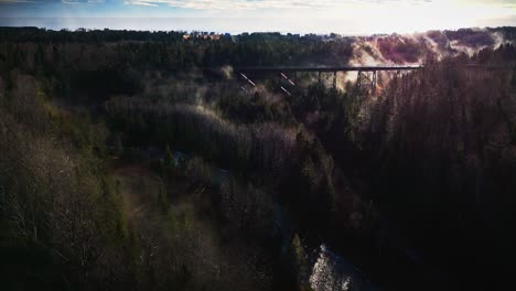 foggy-morning-over-some-trees-and-a-river-shot-by-drone-in-4K-60FPS