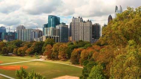 Slowly-rising-above-the-trees-to-reveal-downtown-Atlanta-Georgia-in-the-Fall