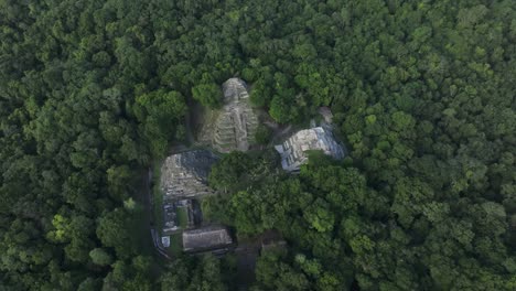 Wide-shot-of-Yaxha-mayan-ruins-north-acropolis-at-Guatemala,-aerial