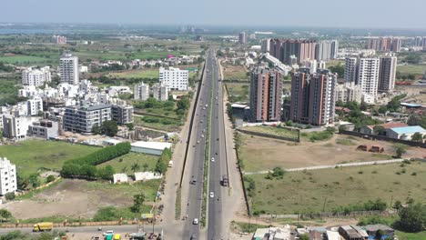 RAJKOT-CITY-AERIEL-VIEW-The-phone-camera-is-moving-towards-a-place-where-construction-work-is-going-on-and-there-are-many-low-rise-buildings-and-residential-houses
