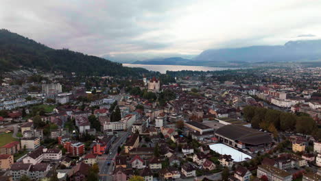 Downtown-Thun-Switzerland-cars-Swiss-village-city-downtown-stunning-Thun-Castle-Dukes-of-Zährigen-Interlocken-Bern-Jungfrau-cloudy-sunrise-sunset-aerial-cinematic-drone-circle-left-slowly-movement