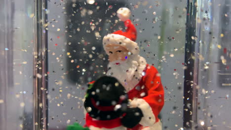 Santa-Claus-and-a-snow-man-dancing-Christmas-snow-globe-decoration
