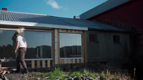 A-Man-is-Constructing-a-Greenhouse-in-Indre-Fosen,-Trondelag-County,-Norway---Timelapse