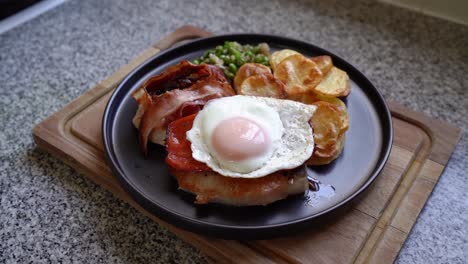Mouthwatering-Plate-Of-Riojan-Style-Ribs-With-Sunny-Side-Up-Egg,-Fried-Bacon-And-Chips
