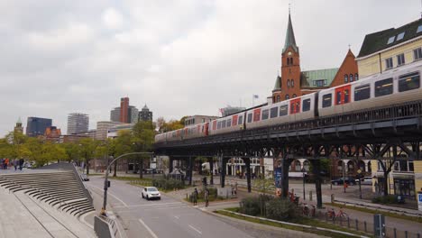 Metro-on-elevated-tracks-in-Hamburg-city-driving-towards-on-overcast-Autumn-day