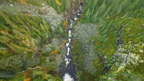 Bird's-Eye-View-Over-Waterfall-And-Swedish-Forest-During-Autumn---Drone-Shot