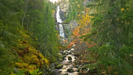 Autumn-Forest-With-Scenic-Waterfall-In-Sweden---Aerial-Pullback
