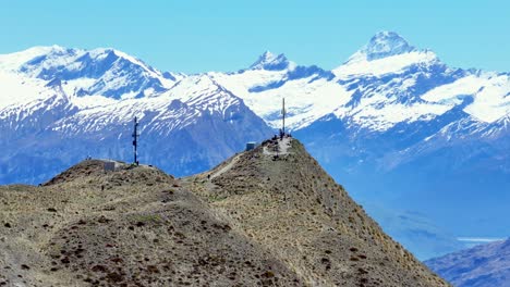 Aerial-panoramic-of-Roys-Peak-mountain-summit-and-beautiful-high-mountains-background,-New-Zealand