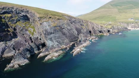 A-drone-shot-of-the-rugged-coastal-terrain-of-the-Dingle-Peninsula,-near-Dingle-Point,-in-Ireland