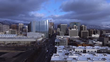 Salt-Lake-City,-Utah-skyline-at-dusk-in-winter---push-in-aerial