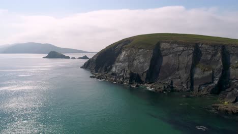 A-drone-shot-of-the-rugged-coastal-terrain-of-the-Dingle-Peninsula,-near-Dingle-Point,-in-Ireland