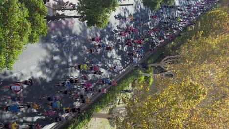 Many-Valencia-Marathon-runners-passing-through-the-streets-of-Valencia,-Spain