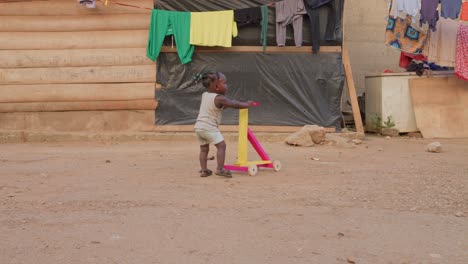 African-girl-with-rustic-walker,-it-allows-her-to-have-mobility-to-her-small-body