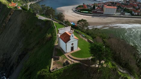 SPECTACULAR-VIEWS-OF-THE-HERMITAGE-OF-LA-GUIA-DOMINATING-THE-ENTRANCE-TO-THE-COVE-OF-THE-MYTHICAL-PORT-OF-RIBADESELLA-IN-ASTURIAS