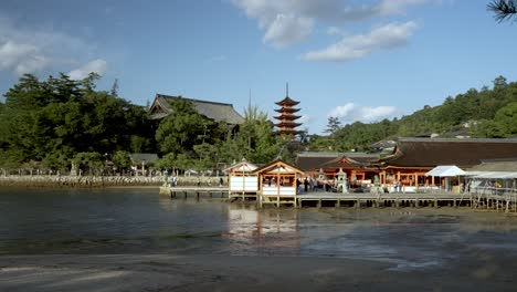 Itsukushima-Shrine-During-Low-Tide-On-Sunny-October-Day-With-View-Of-Five-Tiered-Pagoda-In-Background