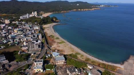 Osatsu-Town-and-Chidorigahama-Beach,-Aerial-View-on-Warm-Sunny-Day-4k