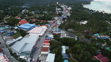 Pantip-township-with-telecommunication-tower-in-Koh-Phangan-island,-aerial-view