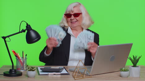 Businesswoman-office-accountant-celebrating-business-success-dancing-with-stack-of-money-dollar-cash
