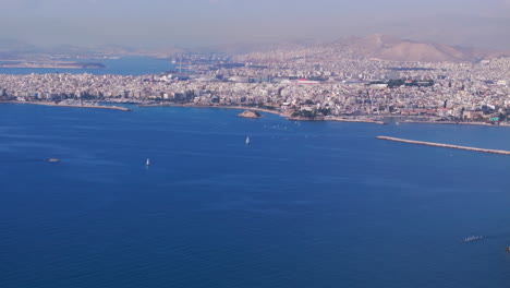 Aerial-slider-shot-over-the-Aegean-sea-and-Athens-city