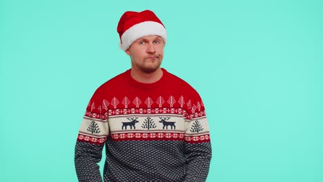 Confused-man-in-Christmas-sweater-feeling-embarrassed-about-ambiguous-question-having-doubts-no-idea