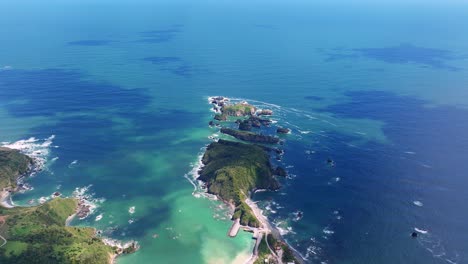 Aerial-Flying-Over-Estaquilla-Coastline-Surrounded-By-Turquoise-Pacific-Ocean-Waters