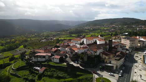 Panoramic-aerial-parallax-around-walled-town-of-Vinhais,-Braganza,-Portugal