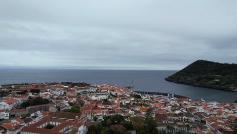 Aerial-view-of-Angra-do-Heroismo-old-town,-Monte-Brasil-and-Atlantic-Ocean-in-Terceira,-Azores