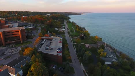 Petoskey-Lake-Michigan-Aerial-Sunrise-Town-Pull-Back