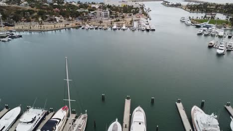 Drone-shot-rising-in-the-San-Jose-del-Cabo-Marina,-Baja-California-Sur-Mexico,-with-boats-in-the-harbor,-wide-aerial-footage