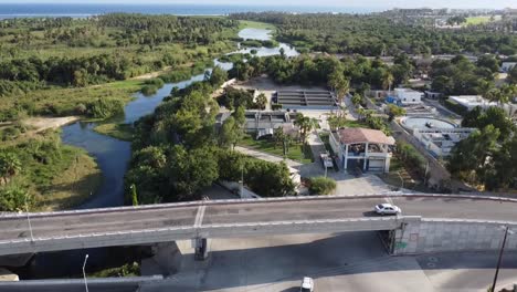 Drone-footage-revealing-Reserva-Ecologica-municipal-Estero-in-San-Jose-del-Cabo-Baja-California-Sur-Mexico,-wetlands-and-forest-with-the-ocean-in-the-distance