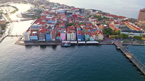 Drone-establishing-view-of-colorful-building-facades-in-Willemstad-Curacao-port-town