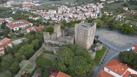 Drone-circles-around-tower-of-medieval-castle-in-historic-center-of-Braganza-Portugal