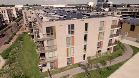 Aerial-pan-showing-exterior-facade-of-social-housing-collective-building-Ubuntuplein-project-in-Zutphen,-The-Netherlands