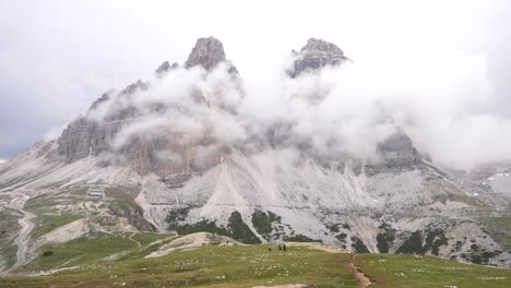 Fog-and-clouds-gather-around-Tre-Cime-di-Lavaredo-in-Auronzo-Valley,-Dolomites,-Italy